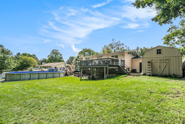 view of yard featuring a swimming pool side deck and a shed