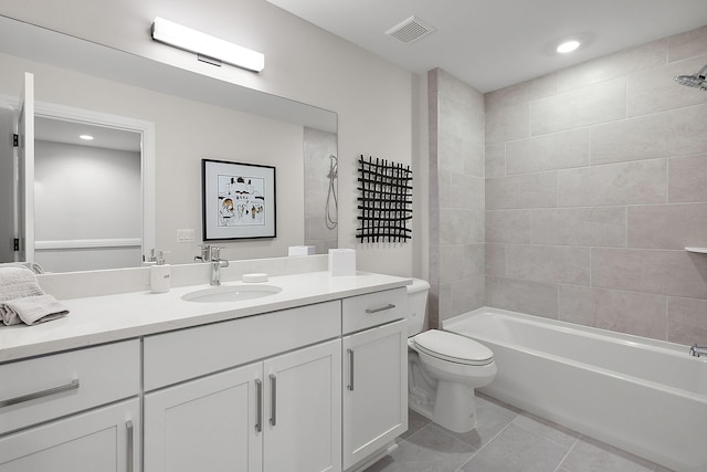 bathroom featuring tile patterned flooring, visible vents, toilet, bathtub / shower combination, and vanity