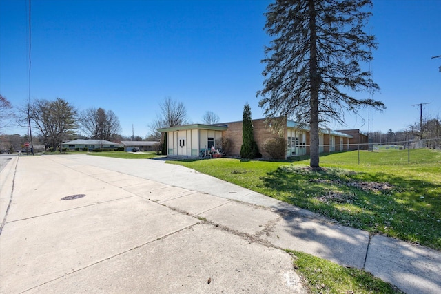 exterior space featuring a front lawn