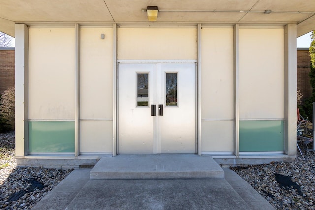 property entrance featuring french doors