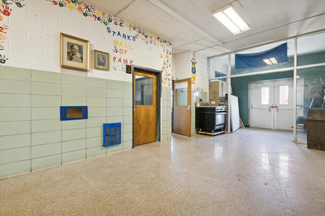 miscellaneous room with a textured ceiling