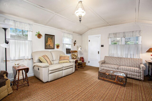 living room featuring vaulted ceiling