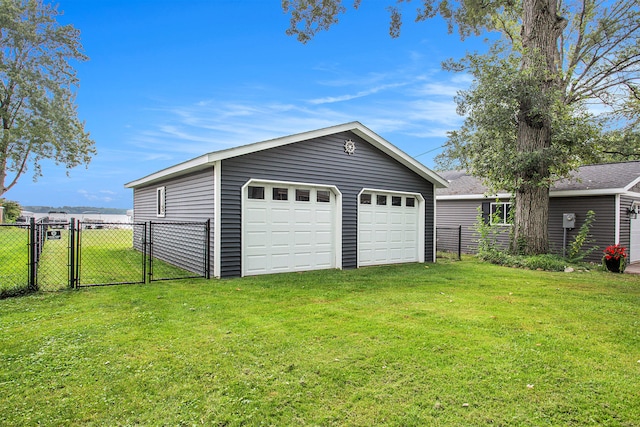 garage featuring a yard