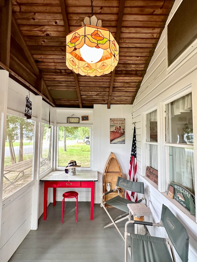 sunroom with wood ceiling and vaulted ceiling with beams