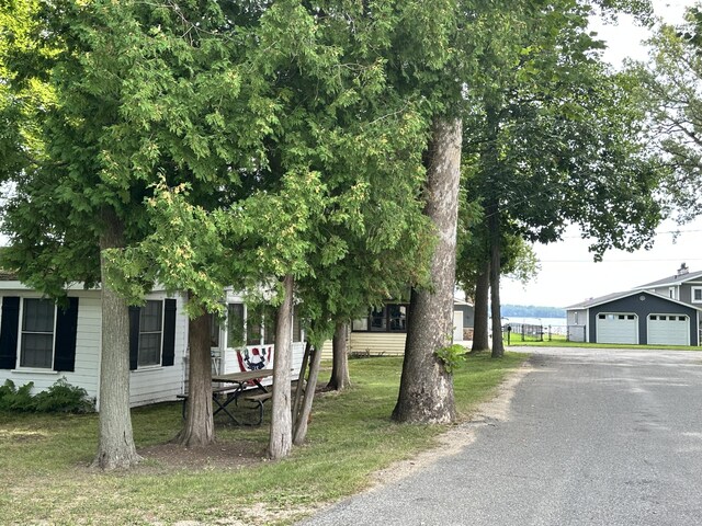 exterior space with an outdoor structure and a garage