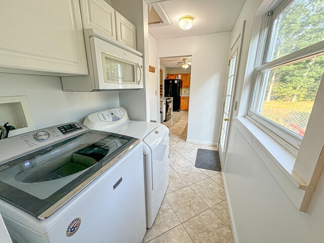 laundry room with a healthy amount of sunlight, ceiling fan, independent washer and dryer, and light tile patterned flooring