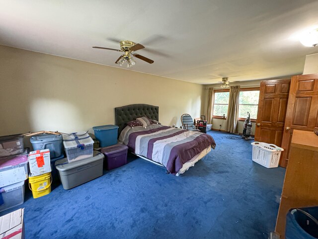 bedroom featuring ceiling fan and carpet flooring