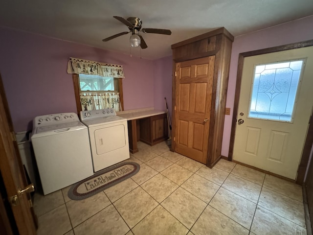 laundry area with ceiling fan, independent washer and dryer, and light tile patterned floors