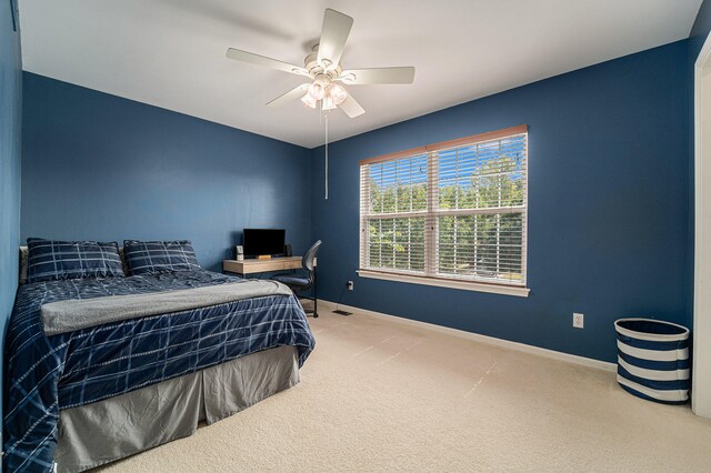 carpeted bedroom featuring ceiling fan