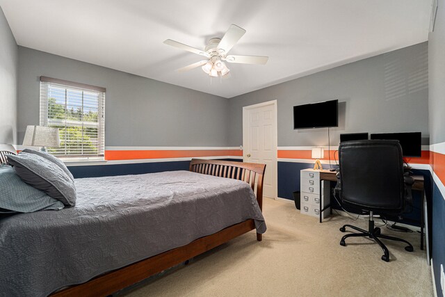 bedroom with ceiling fan and light colored carpet