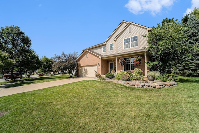 view of front of house with a garage and a front yard