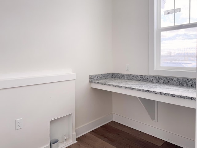 bathroom featuring wood finished floors and baseboards