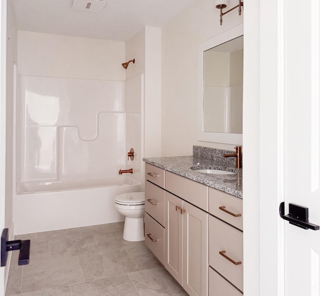 bathroom featuring toilet, shower / bathing tub combination, and vanity