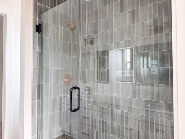 bathroom with a shower stall