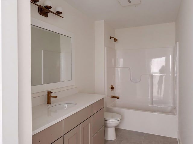 full bathroom with toilet, vanity, tile patterned floors, and shower / washtub combination