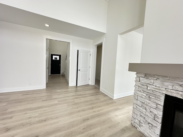 unfurnished living room with light hardwood / wood-style floors and a fireplace