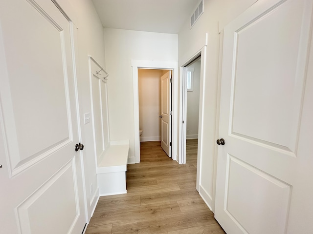 corridor with light wood-type flooring