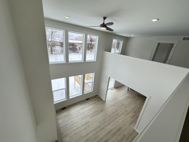 interior space with ceiling fan and light wood-type flooring