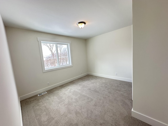 unfurnished room featuring carpet flooring