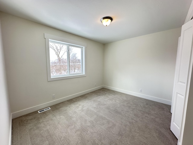 spare room featuring carpet flooring