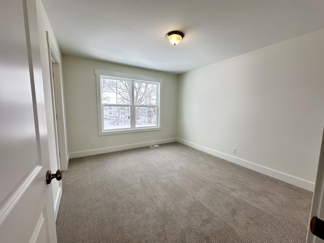 unfurnished room with carpet