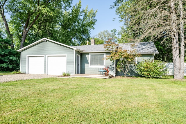 single story home with a garage and a front yard