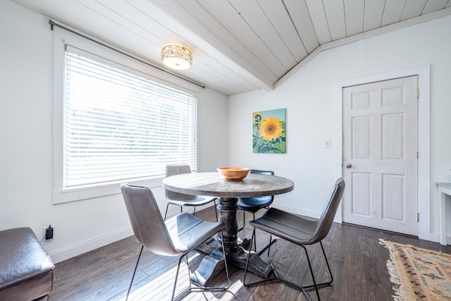 dining room with vaulted ceiling and dark hardwood / wood-style flooring