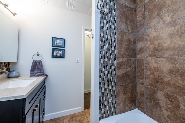 bathroom with tile patterned floors and vanity