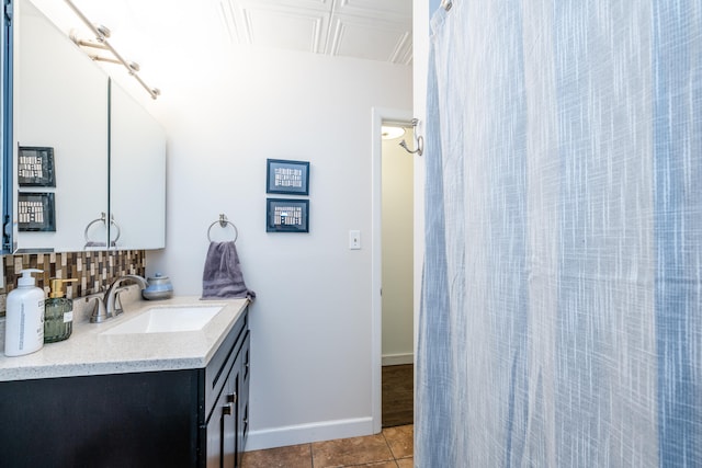 bathroom with tile patterned floors and vanity