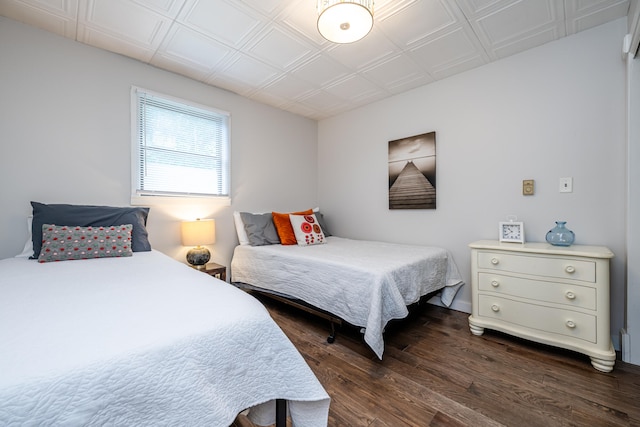 bedroom with hardwood / wood-style floors