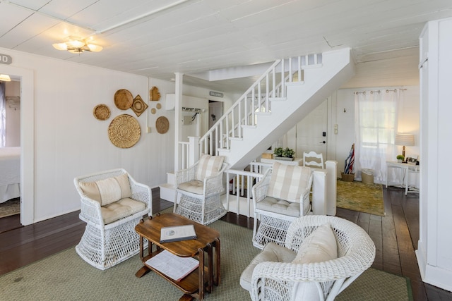 living area with stairway and hardwood / wood-style floors