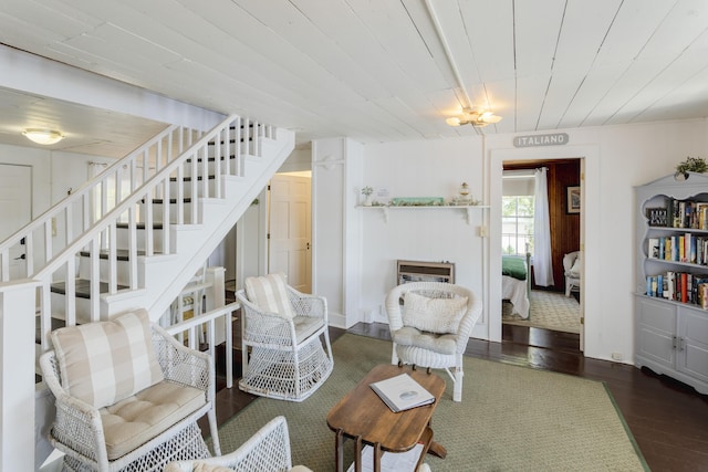 living room with stairway, a fireplace, wood ceiling, and wood finished floors