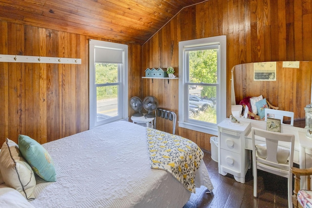 bedroom featuring lofted ceiling, wooden walls, hardwood / wood-style flooring, and wood ceiling