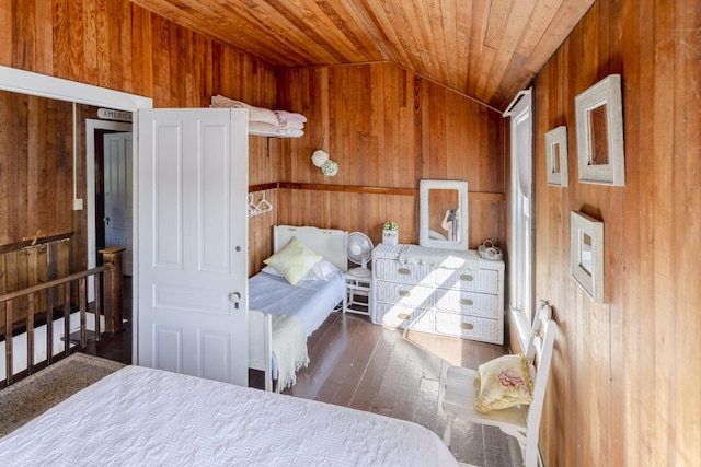 bedroom with wood-type flooring, lofted ceiling, wood ceiling, and wood walls