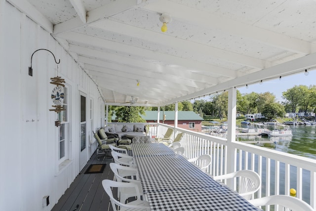 wooden terrace with a water view