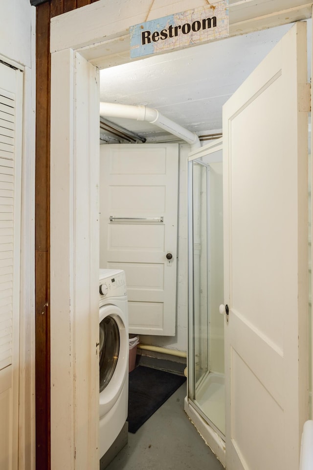 washroom featuring washer / clothes dryer and laundry area