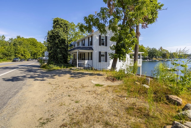 view of front of house featuring board and batten siding and a water view