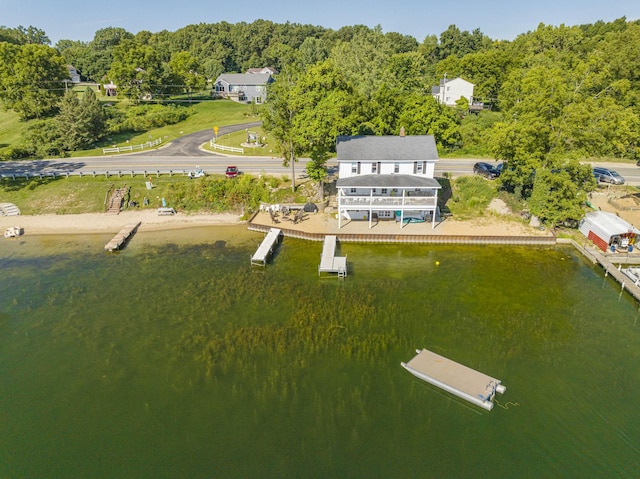 birds eye view of property with a water view