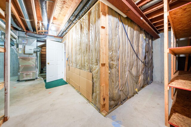 basement featuring heating unit