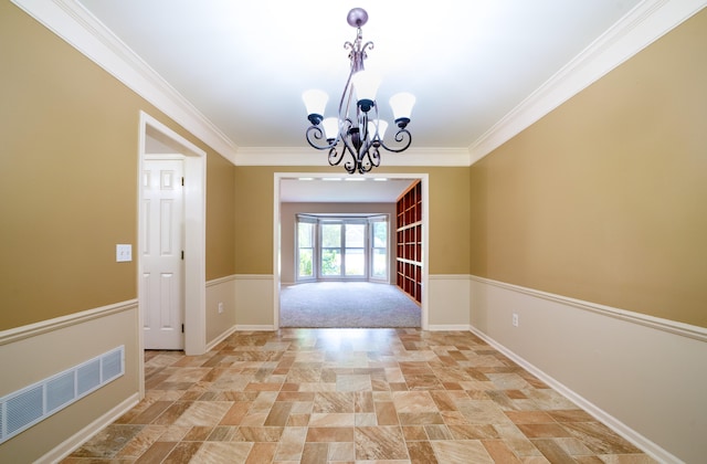 interior space featuring an inviting chandelier and ornamental molding