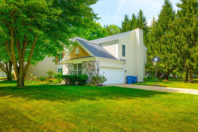 view of front facade with a garage and a front yard