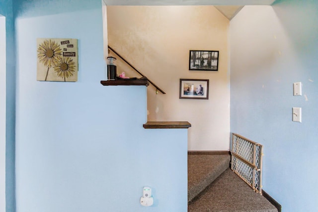 interior space with carpet floors and baseboards