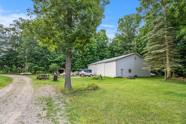 view of yard featuring an outbuilding and an outdoor structure