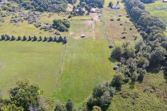 birds eye view of property featuring a rural view