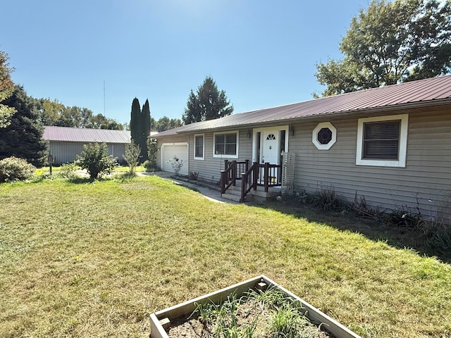 single story home with a garage and a front yard