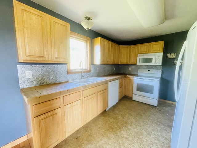 kitchen with tasteful backsplash, light brown cabinetry, a sink, white appliances, and baseboards