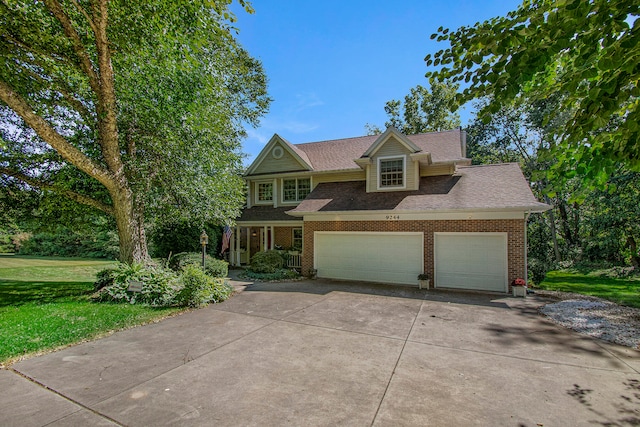 view of front of home with a garage and a front yard