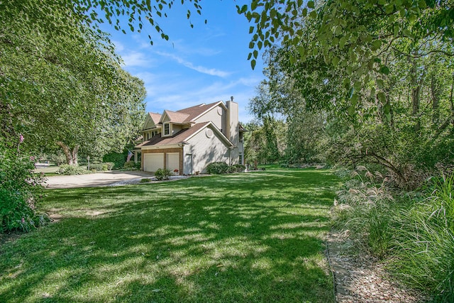 view of yard with a garage