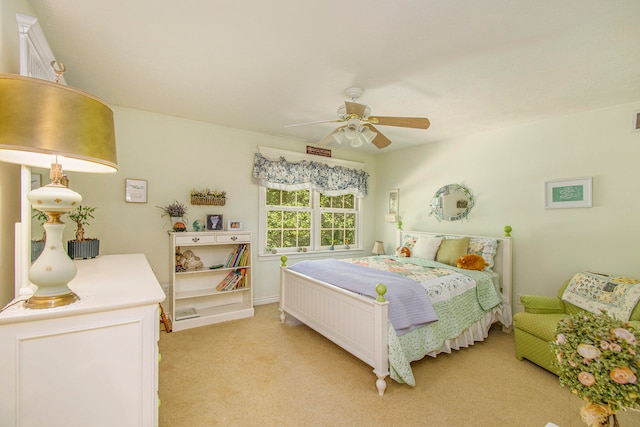 bedroom with light colored carpet and ceiling fan