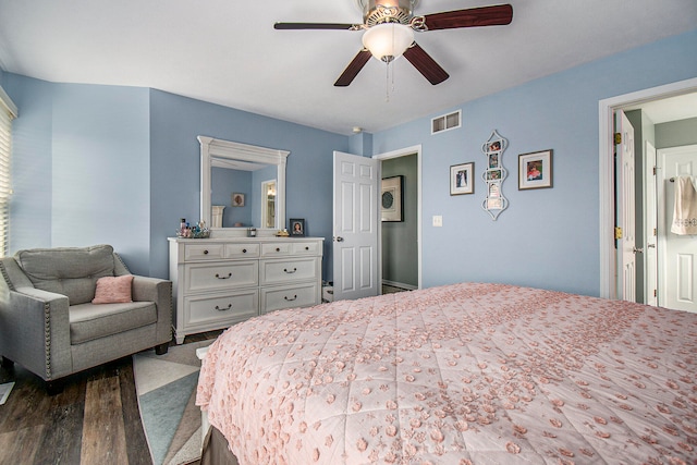 bedroom with ceiling fan and dark hardwood / wood-style flooring